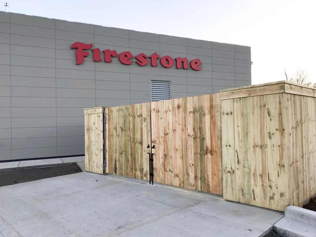dumpster gate installed at Firestone by commercial fence company, lc fence in knoxville