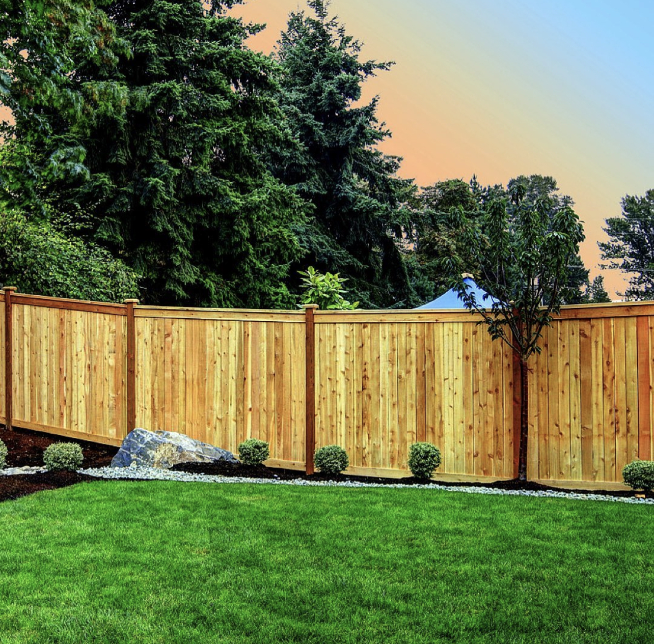 sunset over wood fence installed by LC Fence in Knoxville